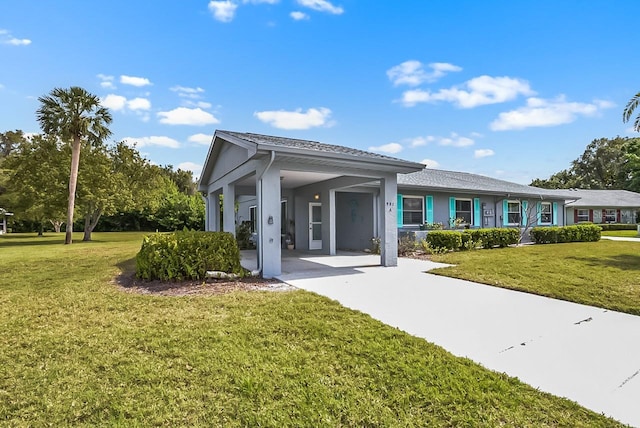 view of front of home featuring a front lawn and stucco siding