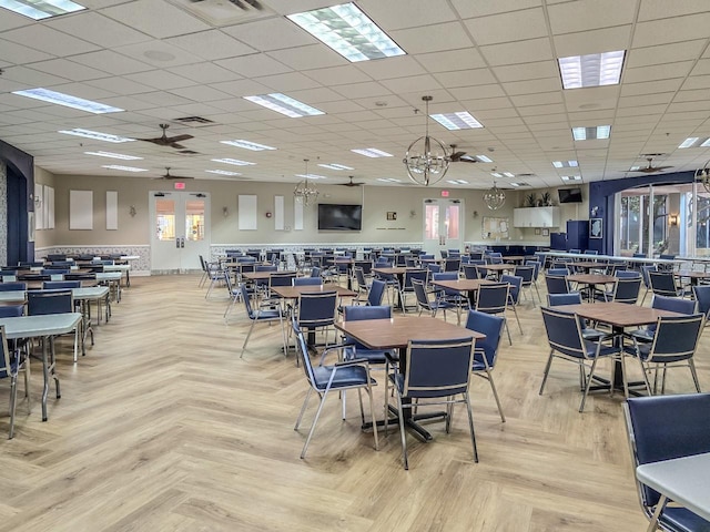 dining room with a paneled ceiling, visible vents, and ceiling fan