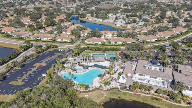 aerial view featuring a water view and a residential view