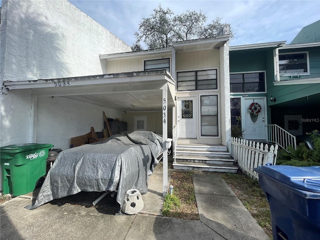 exterior space featuring a carport