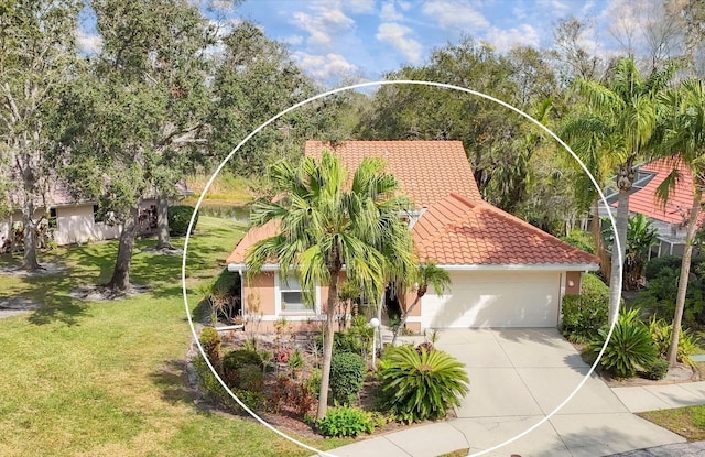 exterior space with a garage, concrete driveway, a tiled roof, a front lawn, and stucco siding