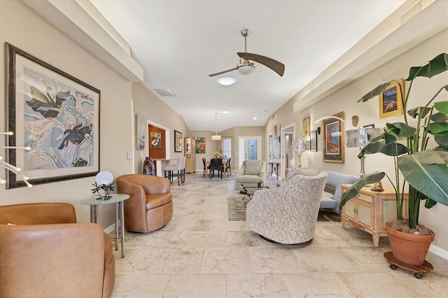 living area with lofted ceiling, visible vents, a ceiling fan, baseboards, and marble finish floor