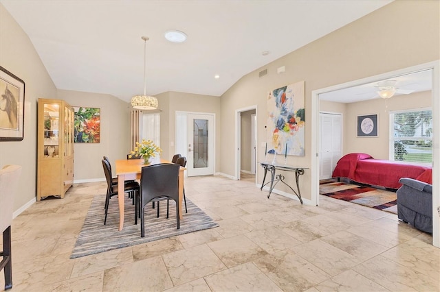 dining room with baseboards, visible vents, ceiling fan, marble finish floor, and vaulted ceiling