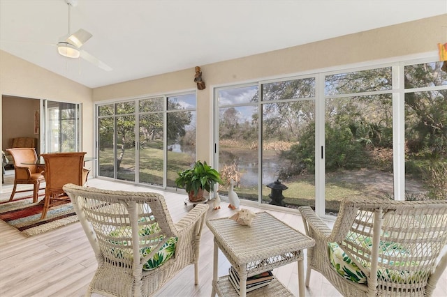 sunroom / solarium featuring vaulted ceiling and a ceiling fan