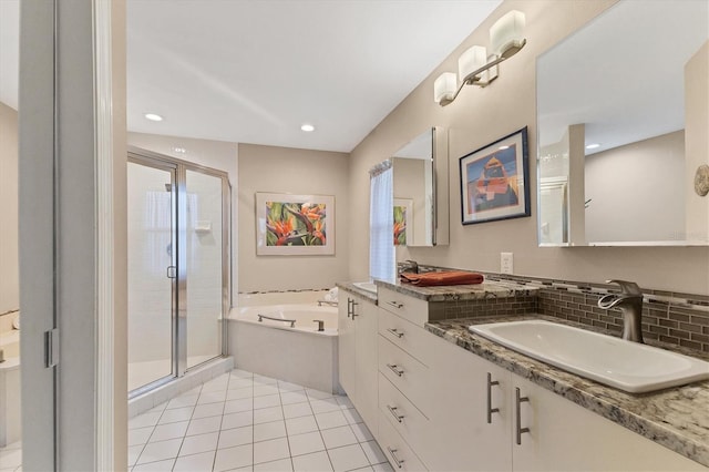 4579 Del Sol Blvd S, Sarasota, FL 34243 - bathroom with a bath, a shower stall, recessed lighting, vanity, and tile patterned flooring