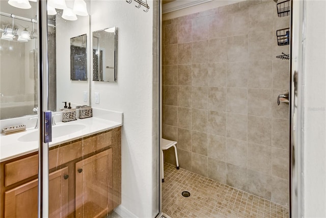 full bathroom featuring a stall shower and vanity