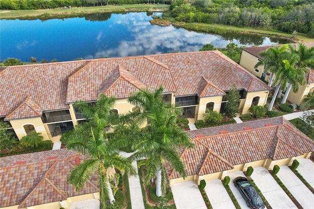 birds eye view of property featuring a water view