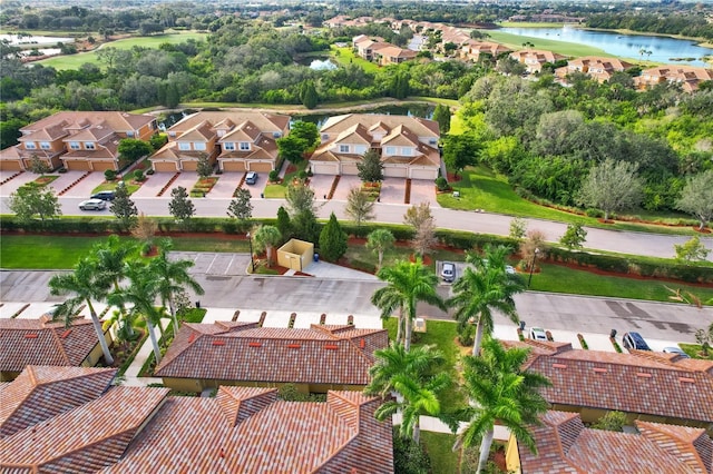 bird's eye view featuring a residential view and a water view