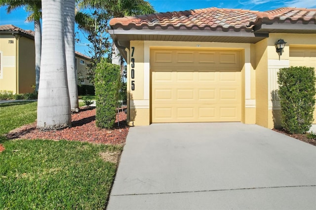 garage featuring concrete driveway