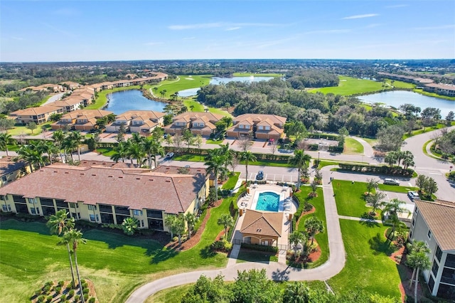 bird's eye view with a residential view and a water view