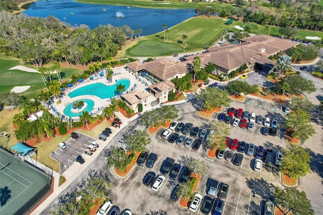 bird's eye view featuring golf course view and a water view