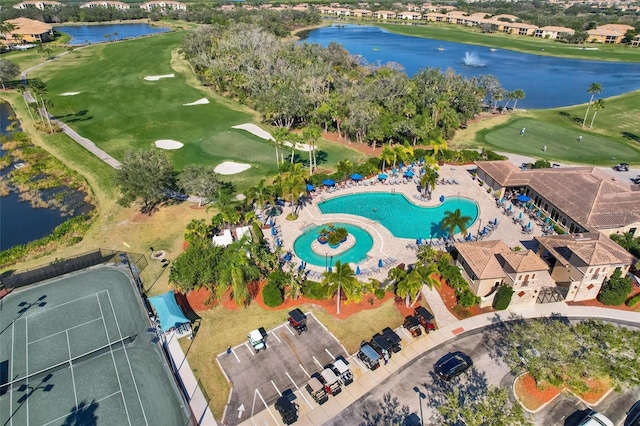 bird's eye view with view of golf course and a water view