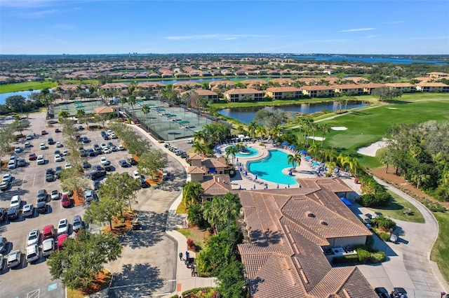 birds eye view of property with a water view