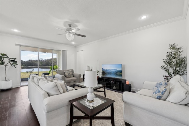 living room featuring wood-type flooring, crown molding, and baseboards