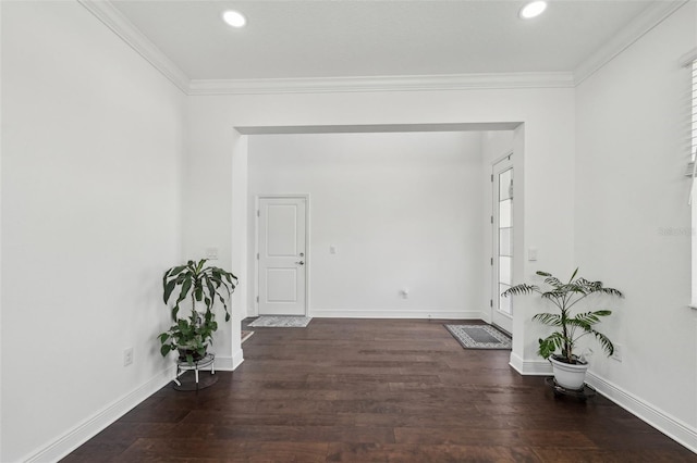 interior space with recessed lighting, crown molding, baseboards, and wood finished floors