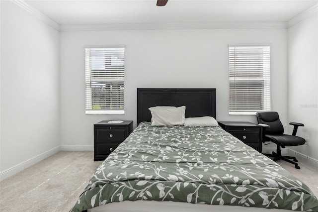 bedroom featuring baseboards, carpet flooring, a ceiling fan, and crown molding