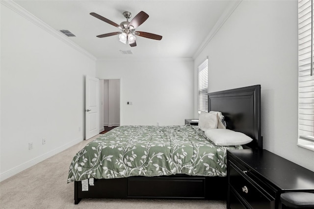 carpeted bedroom with baseboards, visible vents, and crown molding