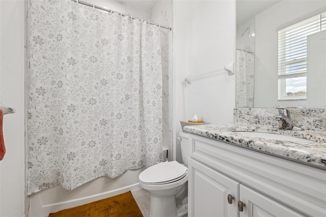 full bathroom featuring shower / bath combination with curtain, vanity, and toilet