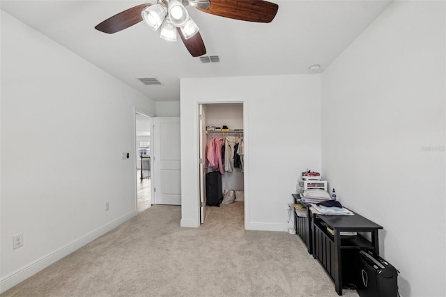 bedroom with baseboards, a spacious closet, visible vents, and light colored carpet