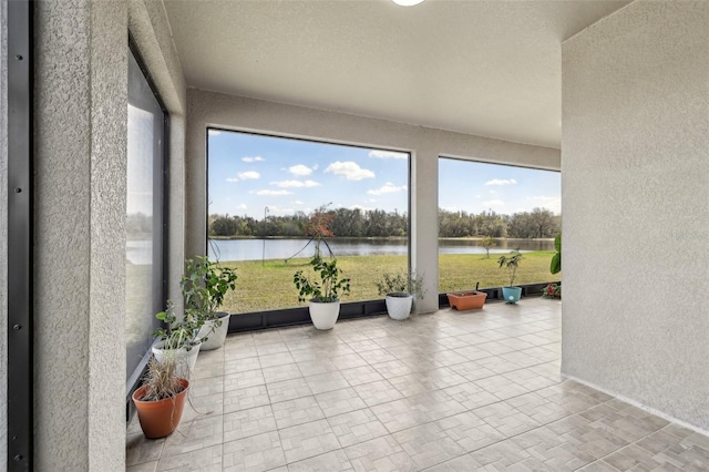 sunroom with a water view