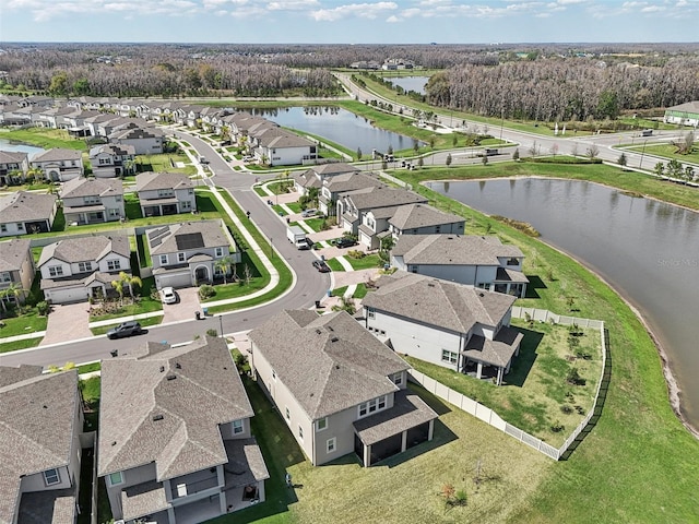 birds eye view of property with a residential view and a water view