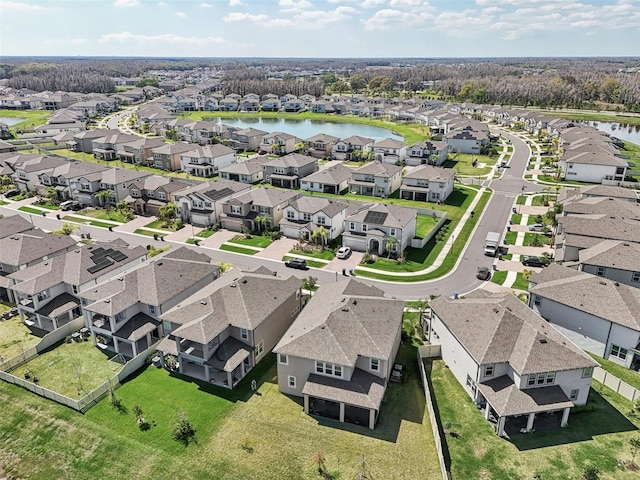 bird's eye view with a water view and a residential view