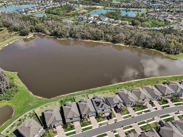 birds eye view of property with a residential view and a water view