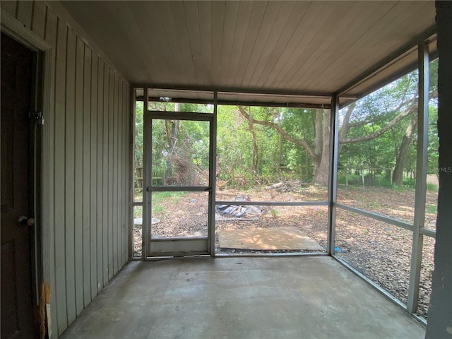 unfurnished sunroom featuring wooden ceiling