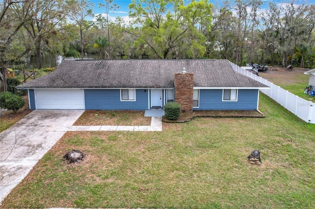 ranch-style home with roof with shingles, concrete driveway, fence, a garage, and a front lawn