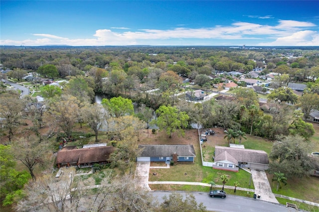 aerial view featuring a wooded view