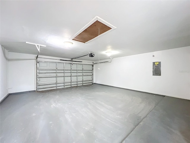 garage featuring electric panel and a garage door opener