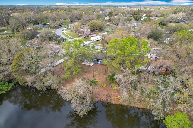 bird's eye view with a water view and a view of trees