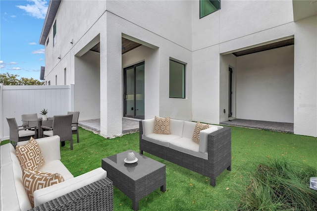 view of patio with outdoor lounge area and fence