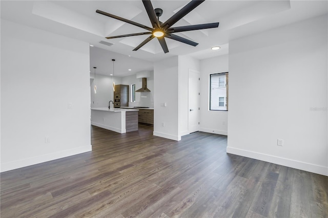 unfurnished living room with dark wood-style floors, recessed lighting, visible vents, ceiling fan, and baseboards