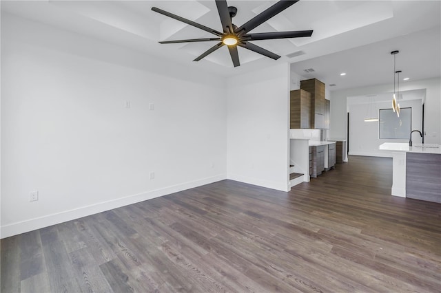 unfurnished living room featuring dark wood-style floors, ceiling fan, recessed lighting, and baseboards