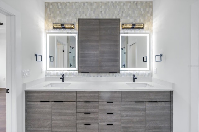 bathroom with double vanity and a sink