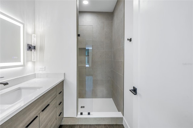 full bath featuring walk in shower and vanity