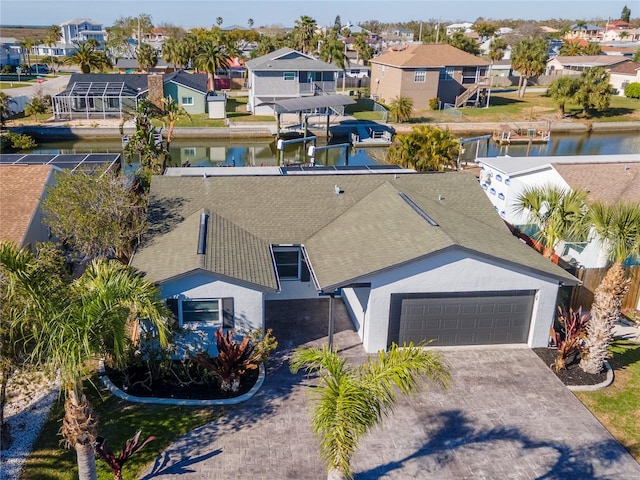 birds eye view of property featuring a residential view and a water view