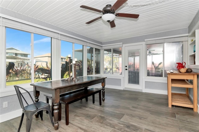 sunroom / solarium with plenty of natural light and ceiling fan