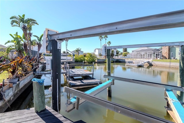 view of dock featuring a water view and boat lift