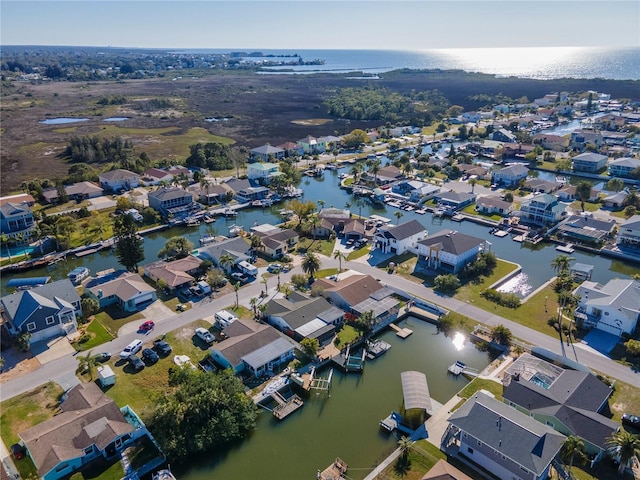 bird's eye view featuring a residential view and a water view