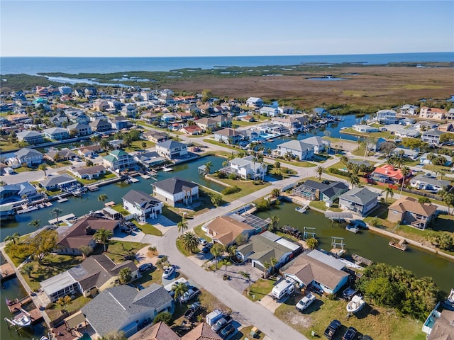 birds eye view of property featuring a water view and a residential view