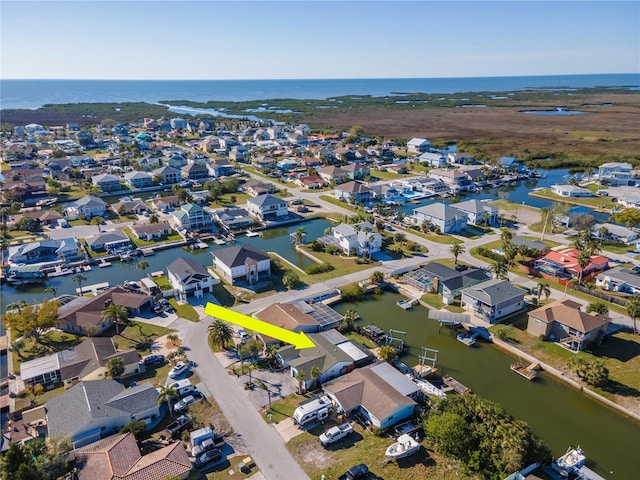 birds eye view of property featuring a residential view and a water view