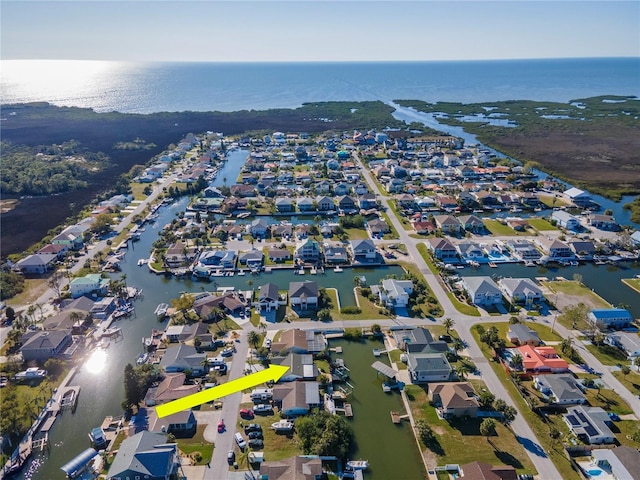 birds eye view of property with a water view and a residential view