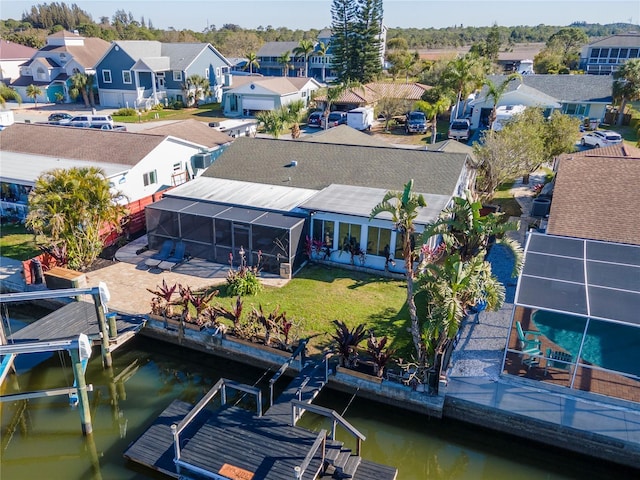 birds eye view of property with a residential view and a water view