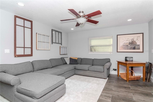 living room featuring wood finish floors, ceiling fan, and recessed lighting