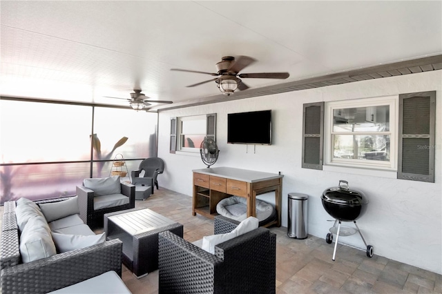 view of patio featuring an outdoor hangout area and ceiling fan