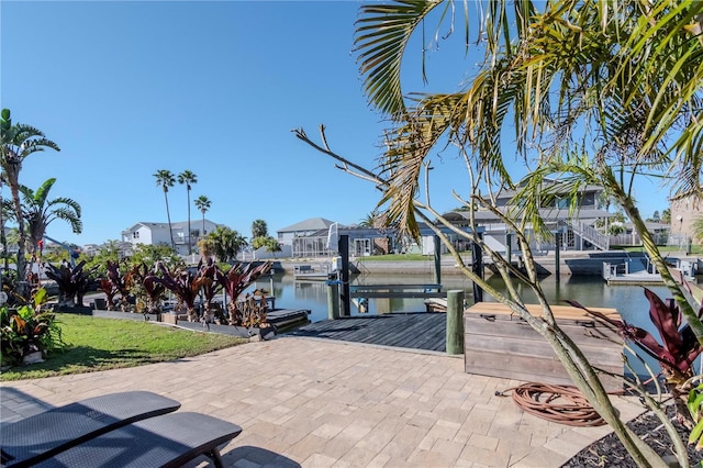 exterior space with a residential view, a boat dock, and a water view