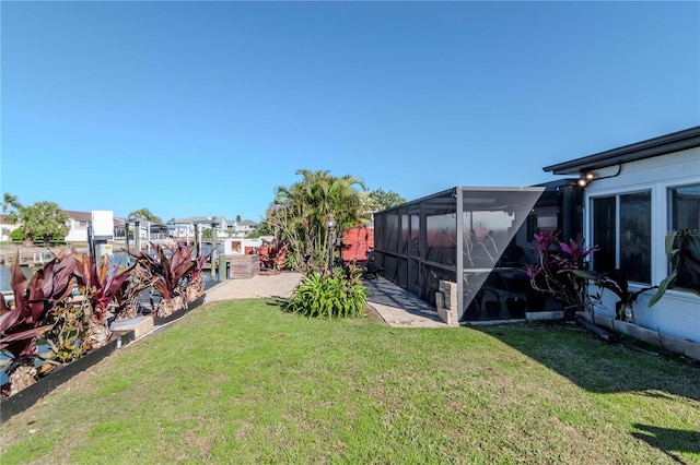 view of yard with glass enclosure