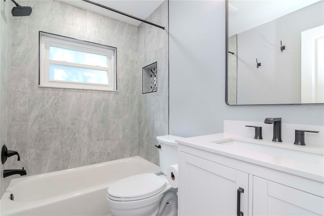 bathroom featuring bathtub / shower combination, toilet, and vanity